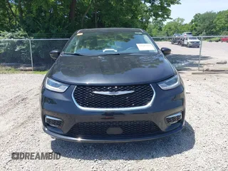 2023 Chrysler Pacifica Touring L with VIN 2C4RC1BG1PR606504, listed as a IAAI auction lot 42647652 with 41,598 mi miles and . Bid and sale history available at DreamBid. Image 13.
