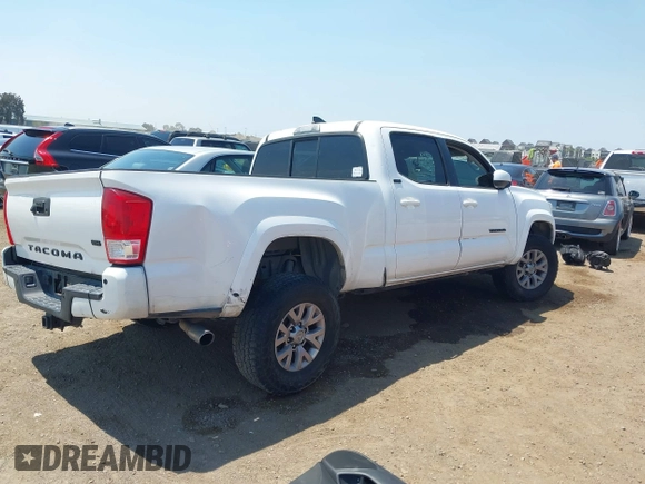 2017 Toyota Tacoma SR5 with VIN 3TMBZ5DN3HM008801, listed as a IAAI auction lot 42660672 with 132,871 mi miles and . Bid and sale history available at DreamBid. Image 4.