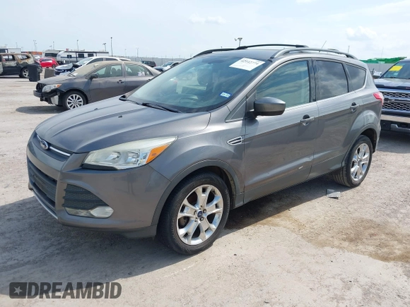 2013 Ford Escape SE with VIN 1FMCU0GXXDUD85470, listed as a IAAI auction lot 42142774 with 145,391 mi miles. Bid and sale history available at carsss.com. Image 2.