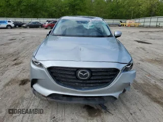 2023 Mazda CX-9 Touring Plus with VIN JM3TCBAY1P0659517, listed as a Copart auction lot 56396565 with 50,544 mi miles and Salvage title. Bid and sale history available at DreamBid. Image 5.
