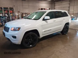 2015 Jeep Grand Cherokee Laredo with VIN 1C4RJFAG4FC660665, listed as a IAAI auction lot 41529532 with 124,099 mi miles. Bid and sale history available at carsss.com. Image 17.
