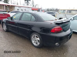 2004 Pontiac Grand Am GT with VIN 1G2NW52E64M677552, listed as a IAAI auction lot 41101595 with 100,644 mi miles. Bid and sale history available at carsss.com. Image 3.