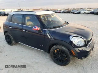 2015 MINI Countryman S with VIN WMWZC5C57FWP48606, listed as a Copart auction lot 47212255 with 104,922 mi miles and Salvage Title. Bid and sale history available at DreamBid. Image 4.