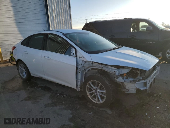 2017 Ford Focus SE with VIN 1FADP3F27HL226219, listed as a Copart auction lot 83667754 with 124,026 mi miles and Salvage Title. Bid and sale history available at carsss.com. Image 4.