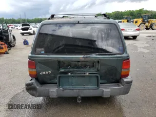 1995 Jeep Grand Cherokee Laredo with VIN 1J4FX58S8SC773884, listed as a Copart auction lot 56572555 with 424,126 mi miles and Salvage title. Bid and sale history available at DreamBid. Image 6.