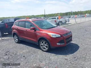 2015 Ford Escape Titanium with VIN 1FMCU0JX5FUB77475, listed as a IAAI auction lot 42103388 with 113,018 mi miles. Bid and sale history available at carsss.com. Image 1.