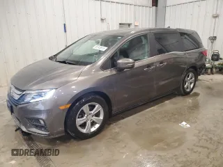 2018 Honda Odyssey EX-L z VIN 5FNRL6H78JB077284, wystawiony jako Copart lot #58743815 z przebiegiem 103 551 mil mil oraz Czysty tytuł • Clean title. Historia ofert i sprzedaży dostępna na DreamBid. Obrazek 1.