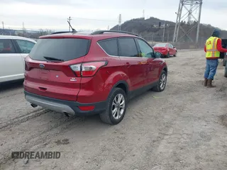 2018 Ford Escape SE z VIN 1FMCU9GD6JUA18684, wystawiony jako IAAI lot #41499540 z przebiegiem 105 127 mil mil oraz . Historia ofert i sprzedaży dostępna na DreamBid. Obrazek 4.