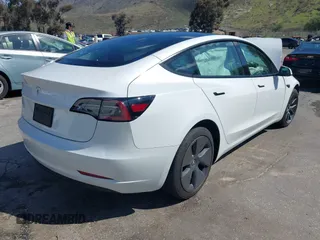 2023 Tesla Model 3 with VIN 5YJ3E1EA4PF462627, listed as a IAAI auction lot 41750103 with 38,463 mi miles and . Bid and sale history available at carsss.com. Image 4.