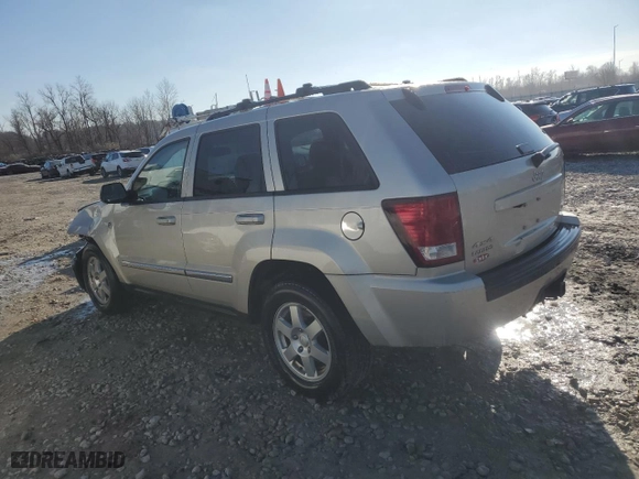 2010 Jeep Grand Cherokee Laredo with VIN 1J4RR4GT1AC106990, listed as a Copart auction lot 87421664 with 106,025 mi miles and Salvage Title. Bid and sale history available at carsss.com. Image 2.