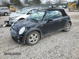 2005 MINI Convertible with VIN WMWRF33485TG11549, listed as a Copart auction lot 87285984 with 58,934 mi miles and Salvage title. Bid and sale history available at DreamBid. Image 1.