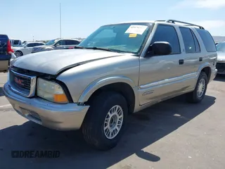 1999 GMC Jimmy SLE with VIN 1GKDT13W5X2539067, listed as a IAAI auction lot 41979222 with 1 mi miles. Bid and sale history available at carsss.com. Image 2.