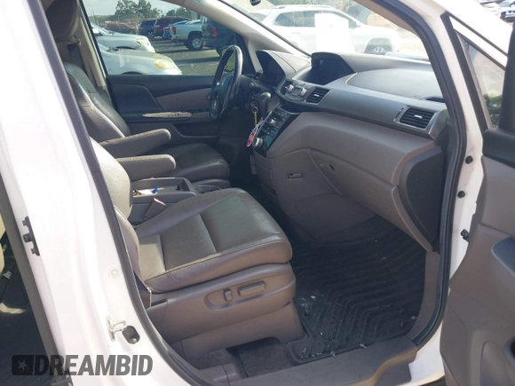 2012 Honda Odyssey EX-L z VIN 5FNRL5H61CB032353, wystawiony jako IAAI lot #42471691 z przebiegiem 186 257 mil mil oraz . Historia ofert i sprzedaży dostępna na DreamBid. Obrazek 5.