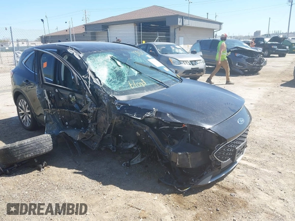 2021 Ford Escape Titanium with VIN 1FMCU9J95MUA77427, listed as a IAAI auction lot 42227275 with 75,079 mi miles and . Bid and sale history available at DreamBid. Image 1.
