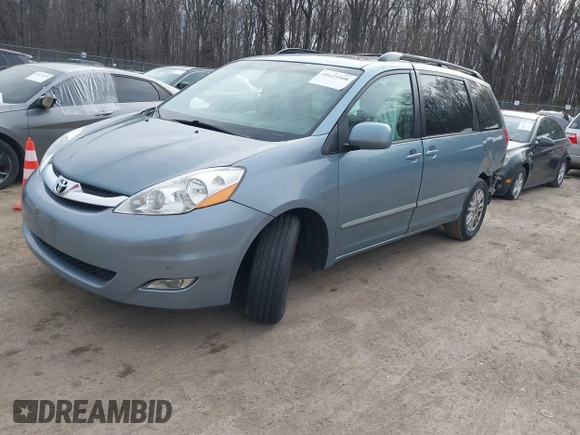 2008 Toyota Sienna XLE with VIN 5TDZK22C18S102498, listed as a IAAI auction lot 41623508 with 214,485 mi miles. Bid and sale history available at carsss.com. Image 2.
