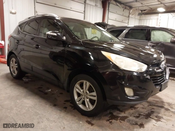 2013 Hyundai Tucson GLS with VIN KM8JU3AC0DU754948, listed as a IAAI auction lot 41811891 with 139,056 mi miles. Bid and sale history available at carsss.com. Image 1.