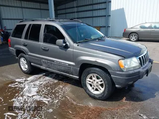 2003 Jeep Grand Cherokee Laredo with VIN 1J4GX48SX3C614719, listed as a IAAI auction lot 42433813 with 111,904 mi miles and . Bid and sale history available at DreamBid. Image 1.