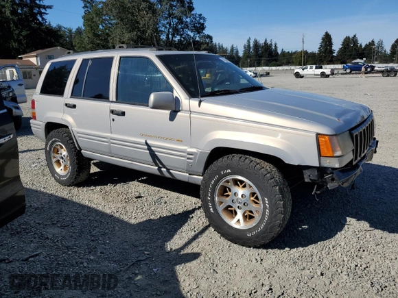 1997 Jeep Grand Cherokee Limited with VIN 1J4GZ78Y5VC598822, listed as a Copart auction lot 74306474 with 276,454 mi miles and Salvage Title. Bid and sale history available at carsss.com. Image 4.