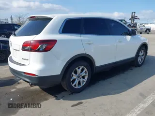 2015 Mazda CX-9 Sport with VIN JM3TB2BAXF0453244, listed as a IAAI auction lot 41905847 with 128,764 mi miles and . Bid and sale history available at carsss.com. Image 4.