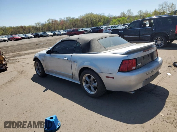 1999 Ford Mustang with VIN 1FAFP4448XF233101, listed as a Copart auction lot 54701005 with 54,585 mi miles and Salvage title. Bid and sale history available at DreamBid. Image 2.