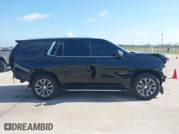 2023 Chevrolet Tahoe LT z VIN 1GNSCNKDXPR477061, wystawiony jako IAAI lot #42225743 z przebiegiem 57 077 mil mil oraz . Historia ofert i sprzedaży dostępna na DreamBid. Obrazek 13.