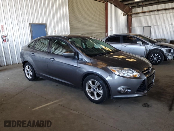 2012 Ford Focus SE with VIN 1FAHP3F28CL114572, listed as a Copart auction lot 63053035 with 142,994 mi miles and Salvage title. Bid and sale history available at DreamBid. Image 4.