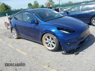 2023 Tesla Model Y Long Range with VIN 7SAYGDEE7PF702051, listed as a IAAI auction lot 42074182 with 50,473 mi miles and . Bid and sale history available at DreamBid. Image 1.