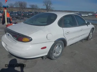 1996 Ford Taurus GL z VIN 1FALP52U0TG128147, wystawiony jako IAAI lot #41604450 z przebiegiem 152 949 mil mil oraz . Historia ofert i sprzedaży dostępna na DreamBid. Obrazek 4.