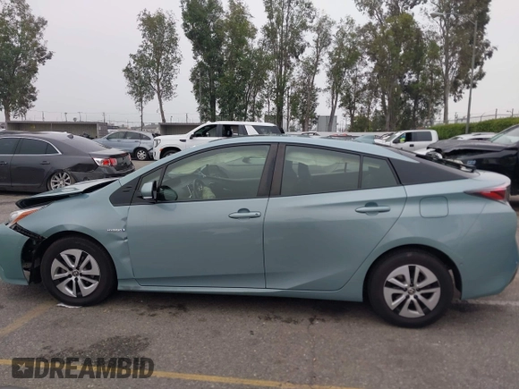 2017 Toyota Prius Two with VIN JTDKARFU7H3052594, listed as a IAAI auction lot 42035969 with 50,789 mi miles and . Bid and sale history available at DreamBid. Image 14.