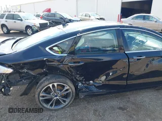 2020 Ford Fusion Titanium with VIN 3FA6P0D9XLR174523, listed as a IAAI auction lot 42100113 with 100,602 mi miles and . Bid and sale history available at DreamBid. Image 6.