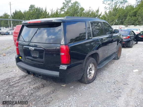 2015 Chevrolet Tahoe LT with VIN 1GNSCBKCXFR687597, listed as a IAAI auction lot 41935279 with 213,290 mi miles. Bid and sale history available at carsss.com. Image 4.