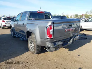 2021 GMC Canyon 4WD AT4 w/Leather with VIN 1GTG6FEN9M1123638, listed as a IAAI auction lot 41852163 with 77,442 mi miles. Bid and sale history available at carsss.com. Image 3.