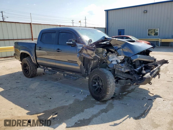 2021 Toyota Tacoma SR with VIN 3TMCZ5AN9MM451389, listed as a Copart auction lot 59191355 with 26,427 mi miles and Salvage title. Bid and sale history available at DreamBid. Image 4.