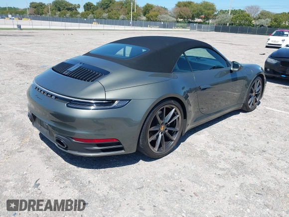 2020 Porsche 911 Carrera S with VIN WP0CB2A97LS263238, listed as a IAAI auction lot 42021346 with 23,899 mi miles. Bid and sale history available at carsss.com. Image 4.