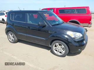 2011 Kia Soul + with VIN KNDJT2A27B7286270, listed as a IAAI auction lot 42063606 with 128,864 mi miles. Bid and sale history available at carsss.com. Image 1.