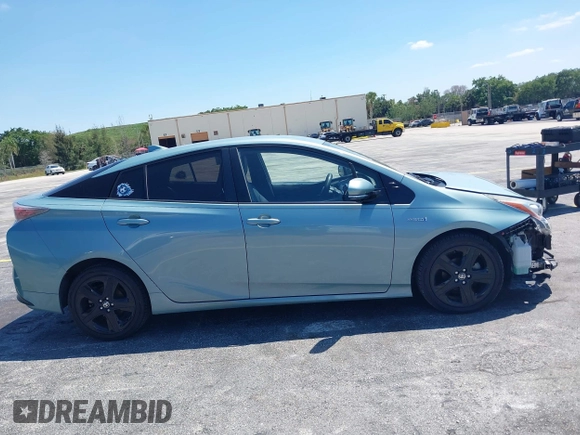 2016 Toyota Prius Four z VIN JTDKARFU0G3016597, wystawiony jako IAAI lot #42034214 z przebiegiem 125 799 mil mil oraz . Historia ofert i sprzedaży dostępna na DreamBid. Obrazek 13.