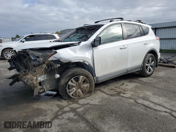 2018 Toyota RAV4 XLE with VIN 2T3WFREV1JW471752, listed as a Copart auction lot 46952565 with 87,705 mi miles and Salvage Title. Bid and sale history available at DreamBid. Image 1.