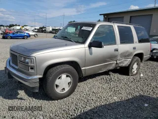 1999 GMC Yukon with VIN 1GKEK13R9XJ740395, listed as a Copart auction lot 83801394 with 185,305 mi miles and Salvage Title. Bid and sale history available at carsss.com. Image 1.