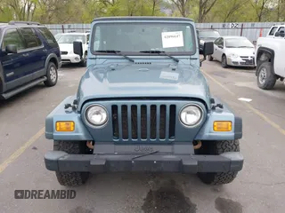 1998 Jeep Wrangler Sport with VIN 1J4FY19S8WP781437, listed as a IAAI auction lot 42096647 with 245,900 mi miles. Bid and sale history available at carsss.com. Image 6.