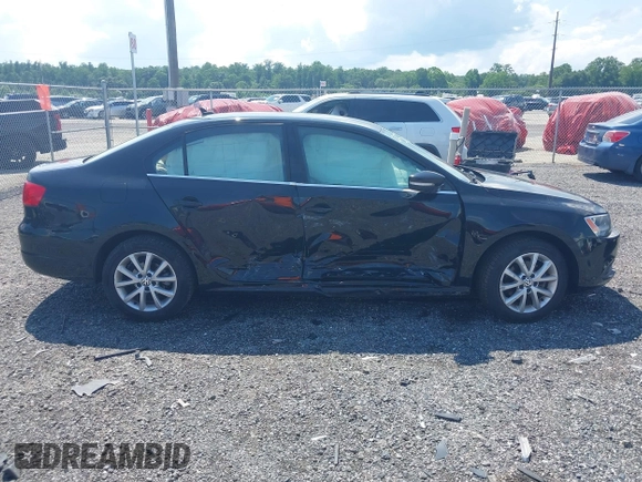 2014 Volkswagen Jetta SE with VIN 3VWD17AJ4EM429576, listed as a IAAI auction lot 42542604 with 142,313 mi miles and . Bid and sale history available at DreamBid. Image 13.