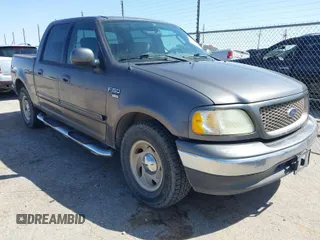 2003 Ford F-150 XLT with VIN 1FTRW07L63KA65904, listed as a IAAI auction lot 41983556 with 166,086 mi miles. Bid and sale history available at carsss.com. Image 1.