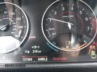 2015 BMW 4 Series 428i xDrive z VIN WBA3N9C56FK246359, wystawiony jako IAAI lot #39911529 z przebiegiem 137 494 mil mil oraz . Historia ofert i sprzedaży dostępna na DreamBid. Obrazek 7.