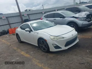 2014 Scion FR-S z VIN JF1ZNAA13E9704272, wystawiony jako IAAI lot #42097565 z przebiegiem 164 543 mil mil oraz . Historia ofert i sprzedaży dostępna na DreamBid. Obrazek 1.