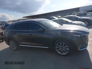 2016 Mazda CX-9 Grand Touring with VIN JM3TCADY8G0114940, listed as a IAAI auction lot 40701187 with 112,311 mi miles and . Bid and sale history available at DreamBid. Image 13.