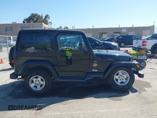 2001 Jeep Wrangler Sahara z VIN 1J4FA59S41P313113, wystawiony jako IAAI lot #42266173 z przebiegiem 125 792 mil mil oraz . Historia ofert i sprzedaży dostępna na DreamBid. Obrazek 13.