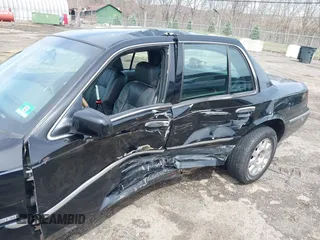 2005 Mercury Grand Marquis LS Premium z VIN 2MEFM75W65X671622, wystawiony jako IAAI lot #41958287 z przebiegiem 154 662 mil mil oraz . Historia ofert i sprzedaży dostępna na DreamBid. Obrazek 6.