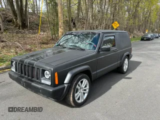1997 Jeep Cherokee with VIN 1J4FT67S6VL571732, listed as a Copart auction lot 61440245 with 153,147 mi miles and Clean title. Bid and sale history available at DreamBid. Image 2.