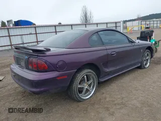 1996 Ford Mustang with VIN 1FALP404XTF174880, listed as a IAAI auction lot 41774122 with 285,302 mi miles. Bid and sale history available at carsss.com. Image 4.