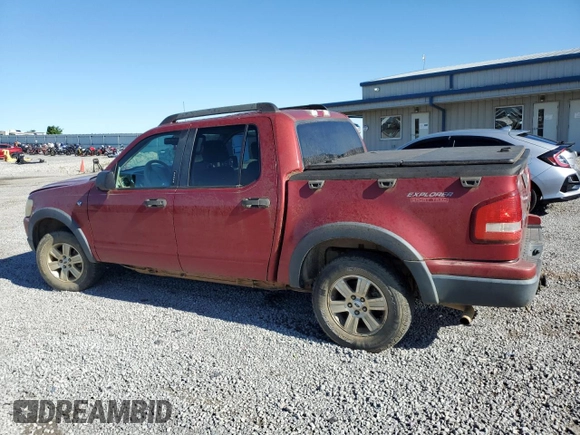 2007 Ford Explorer Sport Trac XLT with VIN 1FMEU51887UA09474, listed as a Copart auction lot 57625115 with 128,443 mi miles and Salvage title. Bid and sale history available at DreamBid. Image 2.