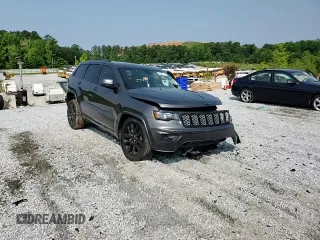 2018 Jeep Grand Cherokee Altitude with VIN 1C4RJEAG4JC145023, listed as a Copart auction lot 59001735 with 127,627 mi miles and Salvage title. Bid and sale history available at DreamBid. Image 14.